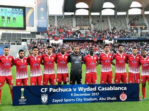Members of Wydad Casablanca's team pose before the start of their FIFA Club World Cup quarter-final match against CF Pachuca at Zayed Sports City Stadium in the Emirati capital Abu Dhabi on December 9, 2017.
GIUSEPPE CACACE / AFP