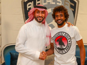 Yasser Al-Shahrani is congratulated on his new deal by club president Sami Al-Jaber. (Photo: @Alhilal_EN)