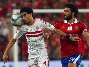 Zamalek's Omar Gaber vies with Al-Ahly's Hossam Ghaly (R) during the Egypt super cup football match between Al-Ahly SC and Zamalek Egyptian football clubs, October 15, 2015 at Sheik Hazza Bin Zayed stadium in Al-Ain, UAE. AFP PHOTO / MARWAN NAAMANI

MARWAN NAAMANI / AFP