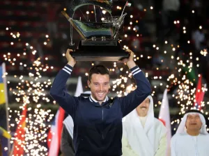 Spain's Roberto Bautista Agut celebrates with the champion's trophy after winning the ATP Dubai Duty Free Tennis Championships on March 3, 2018.
KARIM SAHIB / AFP
