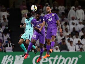 Al-Ain's forward Ahmed Khalil (C) and midfielder Caio (R) vie for the header with Al-Hilal's defender Mohammed Al-Breik during the AFC Champions League football match between UAE's al-Ain and Saudi's al-Hilal at the Hazza bin Zayed Stadium in Al-Ain, on April 2, 2018.
KARIM SAHIB / AFP