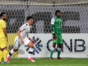 Qatar's al-Sadd player Baghdad Bounedjah (C) celebrates after scoring a goal during the AFC Champions League group stage football match between al-Wasl and al-Sadd at the Zabeel Stadium in Dubai on February 13, 2018.
KARIM SAHIB / AFP