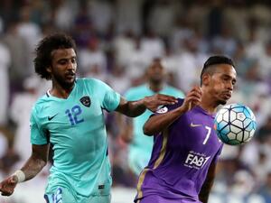 Al-Hilal's defender Yasser Al-Shahrani (L) vies for the ball with Al-Ain's midfielder Caio (R) during their AFC Asian Champions League Group C football match at the Hazza Bin Zayed Stadium in Al-Ain on August 21, 2017.
KARIM SAHIB / AFP