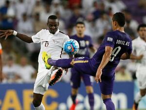 UAE's al-Ain club Dyanfres Douglas (R) fights for the ball against Qatar's el-Jaish club player Yasir Isa during a semi-final first leg match of the Asian Champions League football at Hazza Bin Zayed Stadium Al-Ain on September 27, 2016.
NEZAR BALOUT / AFP