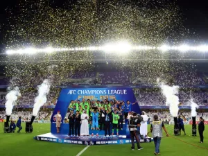 Jeonbuk players celebrate as they are crowned champions following their AFC Champions League final between UAE's Al-Ain and South Korea's Jeonbuk Hyundai Motors at the Hazza bin Zayed Stadium in Al-Ain on November 26, 2016.
NEZAR BALOUT / AFP