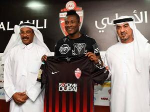Asamoah Gyan, new signing of Al Ahli club with CEO Obaid Saeed and team manager Abdul Majid Hussain at a media conference in Dubai (Photo: Gulf News)