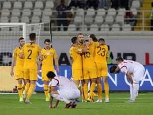 Australia celebrate their 3-2 win in the 2019 AFC Asian Cup group B football match between Australia and Syria at the Khalifa bin Zayed stadium in al-Ain on January 15, 2019.
Karim Sahib / AFP