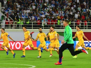 Australia's players celebrate their victory during the 2019 AFC Asian Cup Round of 16 football match between Australia and Uzbekistan at the Khalifa bin Zayed Stadium in Al-Ain on January 21, 2019.
Giuseppe CACACE / AFP