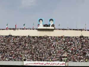 Football fans cheer during the 2018 World Cup qualifying football match between Iran and China at the Azadi Stadium in Tehran on March 28, 2017.
ATTA KENARE / AFP
