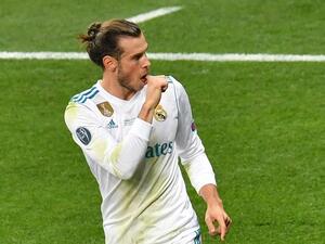 Real Madrid's Welsh forward Gareth Bale celebrates after scoring the the 3-1 during the UEFA Champions League final football match between Liverpool and Real Madrid at the Olympic Stadium in Kiev, Ukraine on May 26, 2018.
Sergei SUPINSKY / AFP