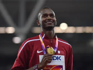Gold medallist Qatar's Mutaz Essa Barshim poses on the podium during the victory ceremony for the men's high jump athletics event at the 2017 IAAF World Championships at the London Stadium in London on August 13, 2017.
Ben STANSALL / AFP