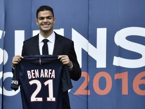 Paris Saint-Germain's new recruit French attacking midfielder Hatem Ben Arfa poses with his jersey at the Parc des Princes stadium in Paris on July 4, 2016.
PHILIPPE LOPEZ / AFP