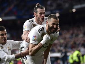 Xabier Etxeita seemed to have earned Huesca a shock draw at Real Madrid, but Karim Benzema fired home to settle a five-goal thriller.