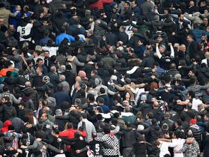 Besiktas supporters react during the second leg of the last 16 UEFA Champions League football match between Besiktas and Bayern Munich at Besiktas Park in Istanbul on March 14, 2018.
Bulent Kilic / AFP
