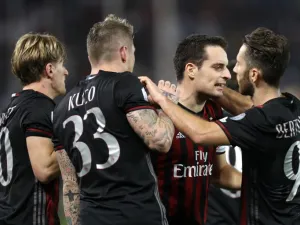 AC Milan's Giacomo Bonaventura (2nd from right) celebrates with teammates scoring a goal against Juventus' team during the Italian Super Cup final match between AC Milan and Juventus in Doha on December 23, 2016.
KARIM JAAFAR / AFP