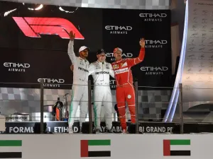 (From L to R) Mercedes' British driver Lewis Hamilton, Mercedes' Finnish driver Valtteri Bottas and Ferrari's German driver Sebastian Vettel celebrate on the podium at the end of the Abu Dhabi Formula One Grand Prix at the Yas Marina circuit on November 26, 2017. Bottas won the season-ending Abu Dhabi Grand Prix on Sunday, finishing ahead of world champion Lewis Hamilton with Sebastian Vettel taking third.
Andrej ISAKOVIC / AFP