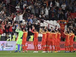 Wu Lei turned in an outstanding individual display as China reached the next stage of the Asian Cup with victory over the Philippines.