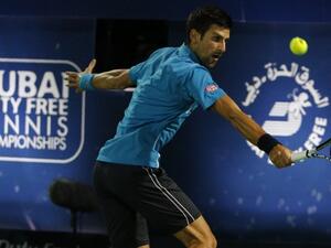 Novak Djokovic of Serbia returns the ball to Tunisian Malek Jaziri during their ATP tennis match on the third round of the Dubai Duty Free Tennis Championships on February 24, 2016. World number one Novak Djokovic recorded his 700th career win when he cruised past Tunisia's Malek Jaziri and into the Dubai Tennis Championships quarter-finals.
Djokovic won 6-1, 6-2 in 65 minutes and will face Spain's Feliciano Lopez for a spot in the last four.
KARIM SAHIB / AFP