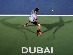Roger Federer of Switzerland returns the ball to France's Benoit Paire during their ATP tennis match as part of the Dubai Duty Free Championships on February 27, 2017.

MAHMOUD KHALED / AFP