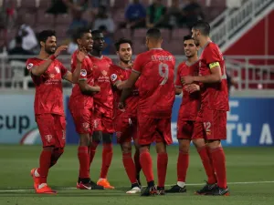 Duhail's players celebrate scoring during their AFC Champions League match between Qatar's Al-Duhail and Emirates' Al-Wahda at the Abdullah bin Khalifa Stadium in Doha on April 17, 2018.
KARIM JAAFAR / AFP