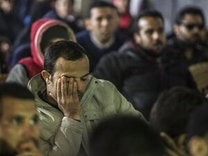 Egyptian fans react as they watch on a screen the Africa Cup of Nations (CAN) football match between Egypt and Cameroon on February 5, 2017, in the capital Cairo, during the 2017 Africa Cup of Nations final in Gabon.
KHALED DESOUKI / AFP