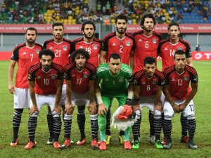 Egypt's squad (back L-R) defender Ahmed Fathi, midfielder Mahmoud Hassan, forward Marwan Mohsen, defender Ali Gabr, defender Ahmed Hegazy, midfielder Ramadan Sobhi, (L-R) forward Mohamed Salah, midfielder Mohamed Elneny, goalkeeper Essam El-Hadary, midfielder Tarek Hamed and defender Mohamed Abdel-Shafy pose for a group picture ahead of the 2017 Africa Cup of Nations group D football match between Egypt and Uganda in Port-Gentil on January 21, 2017.
Justin TALLIS / AFP