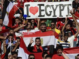Egyptian fans cheer for their national team before the FIFA World Cup 2018 qualification football match between against Uganda at the Borg al-Arab Stadium near Alexandria on September 5, 2017.
KHALED DESOUKI / AFP