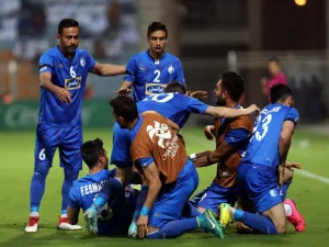 Iranian club Esteghlal's players celebrate after scoring a goal against Saudi club Al-Hilal during their Asian Champions League football match on February 20, 2018 at al-Seeb stadium in Muscat.
MOHAMMED MAHJOUB / AFP