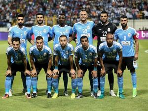 Jordan’s Al-Faisaly players pose for picture a head of football match against Tunis’s Esperance team in the Arab Club championship final match at Alexandria Stadium on August 6, 2017.
STR / AFP