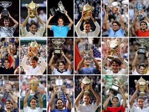 This combination of pictures shows Switzerland's tennis player Roger Federer holding up his 18 Grand Slam titles. 1st row, from left : Australian Open 2017, Wimbledon 2012, Australian Open 2010, Wimbledon 2009, Roland Garros 2009, US Open 2008.
2nd row, from left : US Open 2007, Wimbledon 2007, Australian Open 2007, US Open 2006, Wimbledon 2006, Australian Open 2006.
3rd row, from left : US Open 2005, Wimbledon 2005, US Open 2004, Wimbledon 2004, Australian Open 2004, Wimbledon 2003.
STF / AFP