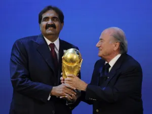 Emir of the State of Qatar Sheikh Hamad bin Khalifa Al-Thani (L) receives the World Cup trophy from Fifa President Joseph Blatter (R) after the official announcement that Qatar will host the 2022 World Cup on December 2, 2010 at the FIFA headquarters in Zurich. AFP PHOTO / PHILIPPE DESMAZES
PHILIPPE DESMAZES / AFP