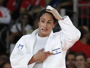 Israel's Yarden Gerbi celebrates after defeating Japan's Miku Tashiro during their women's -63kg judo contest bronze medal A match of the Rio 2016 Olympic Games in Rio de Janeiro on August 9, 2016.
Jack GUEZ / AFP