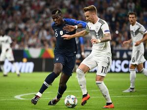 صراع على الكرة بين ماركو رويس وبول بوغبا