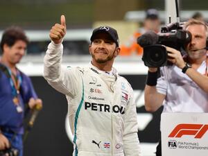 Mercedes' British driver Lewis Hamilton celebrates after taking the pole position in the qualifying session at the Yas Marina circuit on November 24, 2018, in Abu Dhabi, ahead of the Abu Dhabi Formula One Grand Prix.
Andrej ISAKOVIC / AFP