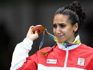 Tunisia's bronze medallist Ines Boubakri cries on the podium during the medal ceremony for the women's individual foil fencing event of the Rio 2016 Olympic Games at the Carioca Arena 3 in Rio de Janeiro on August 10, 2016.
Kirill KUDRYAVTSEV / AFP