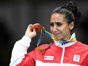 Tunisia's bronze medallist Ines Boubakri cries on the podium during the medal ceremony for the women's individual foil fencing event of the Rio 2016 Olympic Games at the Carioca Arena 3 in Rio de Janeiro on August 10, 2016.
Kirill KUDRYAVTSEV / AFP