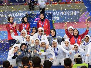 Members of the Iran women's national futsal team celebrate after winning the 2018 AFC Women's Futsal Championship at Indoor Stadium Huamark, Bangkok, Thailand, on May 12, 2018. (Photo: Press TV)