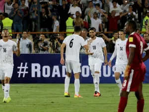 Iran's Alireza Jahan Bakhsh (3rd L) celebrates after scoring a goal during their World Cup 2018 Asia qualifying football match between Iran and Qatar at the Azadi stadium in Tehran on September 1, 2016. Iran won 2 - 0.
ATTA KENARE / AFP