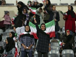 Iranian women cheer during the friendly football match between Iran and Bolivia at the Azadi Stadium in Tehran on October 16, 2018.
STR / AFP