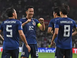 Japan's midfielder Genki Haraguchi (R) is congratulated for his goal during the 2019 AFC Asian Cup semi-final football match between Iran and Japan at the Hazza Bin Zayed Stadium in Abu Dhabi on January 28, 2019.
Roslan RAHMAN / AFP