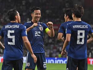 Japan's midfielder Genki Haraguchi (R) is congratulated for his goal during the 2019 AFC Asian Cup semi-final football match between Iran and Japan at the Hazza Bin Zayed Stadium in Abu Dhabi on January 28, 2019.
Roslan RAHMAN / AFP