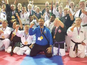 Jordanian karate coach Hussam Ayyad (centre) joins winners of an international competition in a group photo held in the US recently (Photo courtesy of Hussam Ayyad)