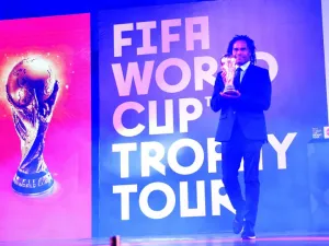 Retired French footballer Christian Karembeu holds the FIFA World Cup Trophy during a ceremony in Lahore on February 3, 2018. The FIFA World Cup Trophy Tour is heading to 50 countries across six continents before returning to the host country in May, ahead of the 2018 FIFA World Cup in Russia.
ARIF ALI / AFP