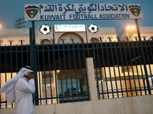 A man walks past the Kuwaiti Football Association (KFA)'s headquarters on October 17, 2015, in Kuwait City. The KFA was suspended by FIFA on October 16, 2015, for government interference, a decision which could impact the team's hopes of qualifying for the 2018 World Cup. AFP PHOTO / YASSER AL-ZAYYAT
YASSER AL-ZAYYAT / AFP