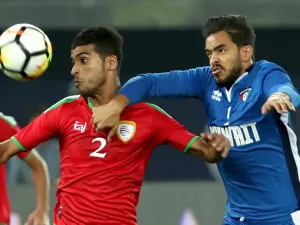 Kuwait's Faisal Ajab (R) vies for the ball with Oman's Mohammad Bin Saleh during the 2017 Gulf Cup of Nations football match between Kuwait and Oman at the Sheikh Jaber al-Ahmad Stadium in Kuwait City on December 25, 2017.

Yasser Al-Zayyat / AFP