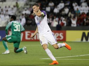 Al Ain FC's Swedish forward and captain Marcus Berg celebrates after scoring a goal against Al-Rayyan SC during their Asian Champions League football match at Jassim Bin Hamad Stadium in Doha on April 16, 2018.
KARIM JAAFAR / AFP