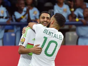 Algeria's forward Riyad Mahrez (back) celebrates with Algeria's midfielder Nabil Bentaleb after scoring a goal during the 2017 Africa Cup of Nations group B football match between Algeria and Zimbabwe in Franceville on January 15, 2017.
KHALED DESOUKI / AFP