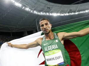 Algeria's Taoufik Makhloufi celebrates winning the silver medal in the Men's 1500m Final during the athletics event at the Rio 2016 Olympic Games at the Olympic Stadium in Rio de Janeiro on August 20, 2016.
Adrian DENNIS / AFP