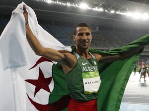 Algeria's Taoufik Makhloufi celebrates after winning second place in the Men's 800m Final during the athletics competition at the Rio 2016 Olympic Games at the Olympic Stadium in Rio de Janeiro on August 15, 2016.
Adrian DENNIS / AFP
