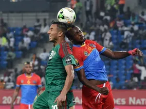 Democratic Republic of the Congo's midfielder Merveille Bokadi (R) heads the ball with Morocco's forward Aziz Bouhaddouz during the 2017 Africa Cup of Nations group C football match between DR Congo and Morocco in Oyem on January 16, 2017.
ISSOUF SANOGO / AFP